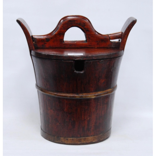 247 - Two Chinese stained wood rice carriers of bucket form, with covers, 33cm high, and another, smaller.... 