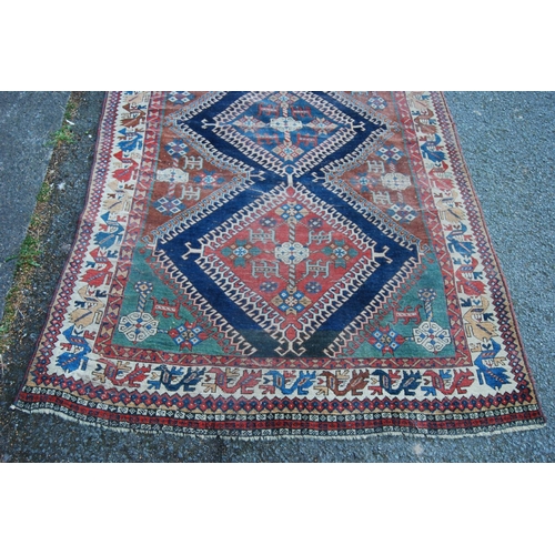 314 - Qashqai-style hand-knotted rug with three geometric medallions to the centre and further geometric m... 