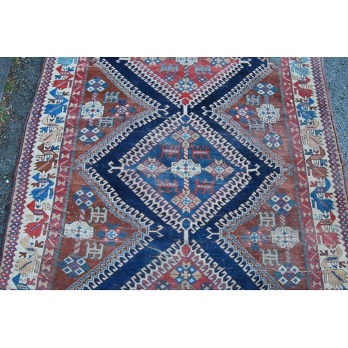 314 - Qashqai-style hand-knotted rug with three geometric medallions to the centre and further geometric m... 