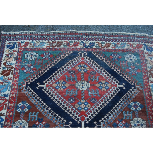 314 - Qashqai-style hand-knotted rug with three geometric medallions to the centre and further geometric m... 