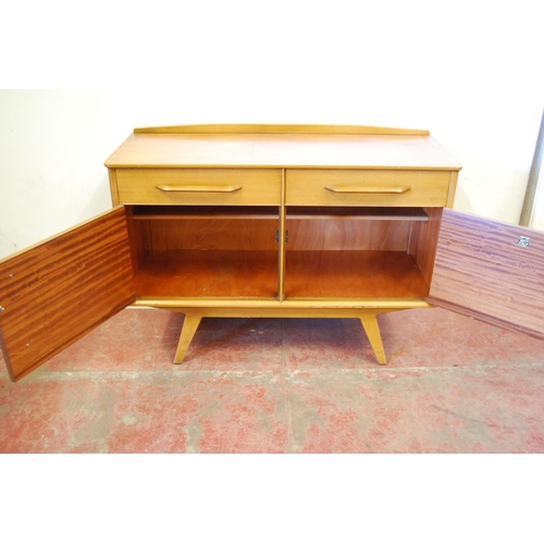 322 - Ernest Gomme 1950s dining room suite comprising a two-door sideboard, dining table and six chairs, l... 