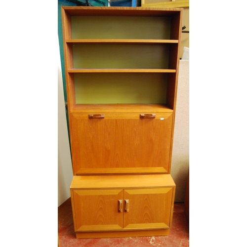 323 - G Plan 1960s teak modular display unit comprising three matching cabinets, each with two glazed door... 