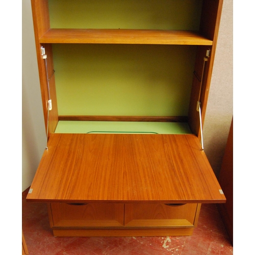 323 - G Plan 1960s teak modular display unit comprising three matching cabinets, each with two glazed door... 