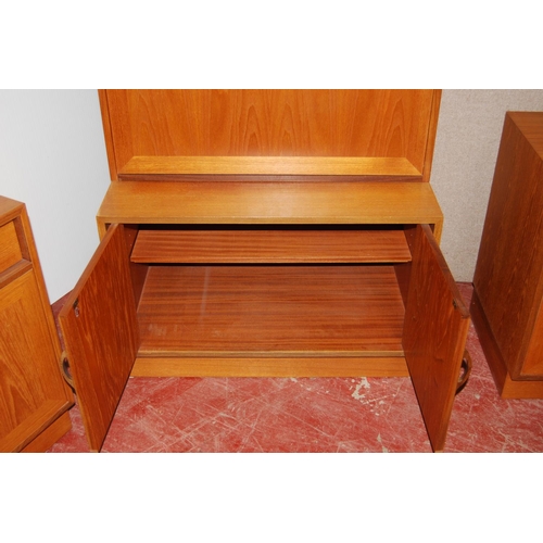 323 - G Plan 1960s teak modular display unit comprising three matching cabinets, each with two glazed door... 