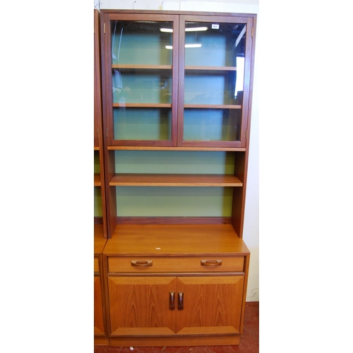 323 - G Plan 1960s teak modular display unit comprising three matching cabinets, each with two glazed door... 