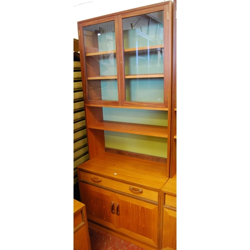 323 - G Plan 1960s teak modular display unit comprising three matching cabinets, each with two glazed door... 