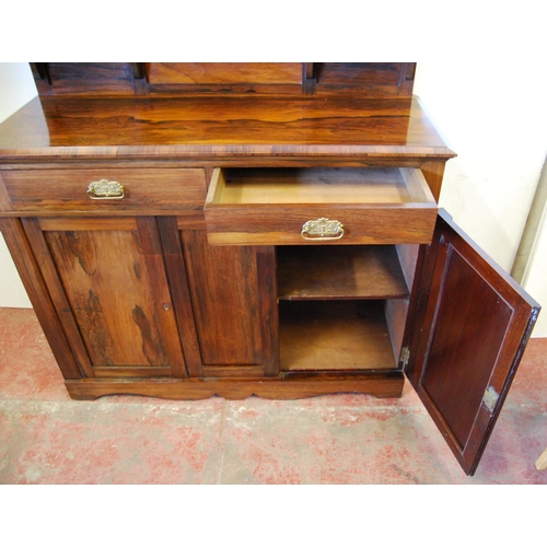 325 - Victorian rosewood chiffonier, the top section with an oval mirrored panel flanked by square shelves... 