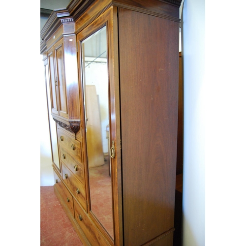 326 - Edwardian inlaid mahogany wardrobe, the shaped cornice with dentil decoration above two doors, carve... 