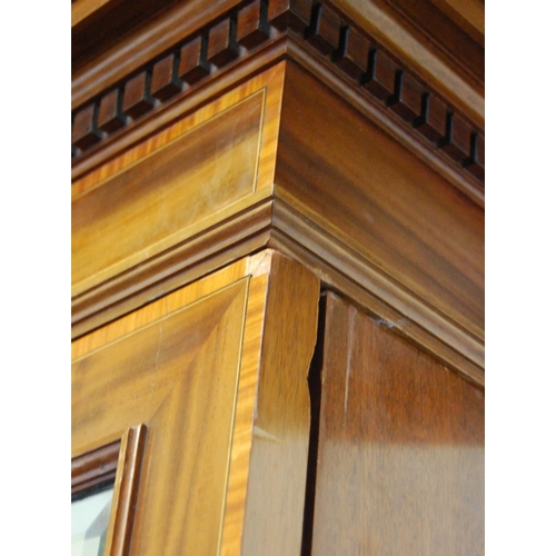 326 - Edwardian inlaid mahogany wardrobe, the shaped cornice with dentil decoration above two doors, carve... 