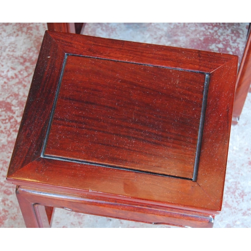 327 - Chinese hardwood nest of quartetto tables, the largest table 66cm high, 51cm wide and 36cm deep.