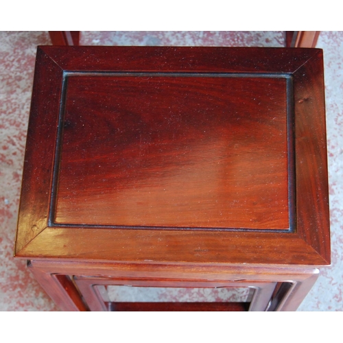 327 - Chinese hardwood nest of quartetto tables, the largest table 66cm high, 51cm wide and 36cm deep.