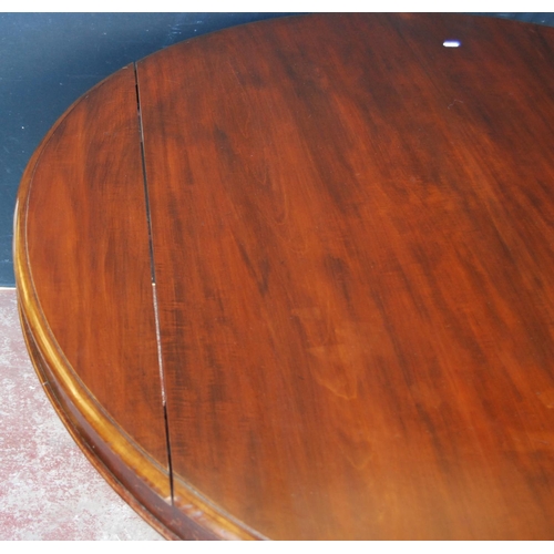 346 - Early 19th century Irish-style mahogany breakfast table, the circular snap action top on a cylindric... 