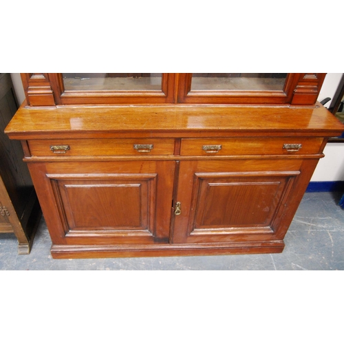 347 - Late Victorian mahogany library bookcase, the shaped cornice above two large glazed doors enclosing ... 