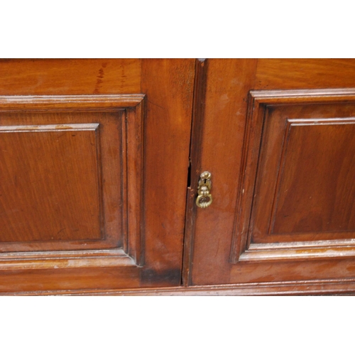 347 - Late Victorian mahogany library bookcase, the shaped cornice above two large glazed doors enclosing ... 