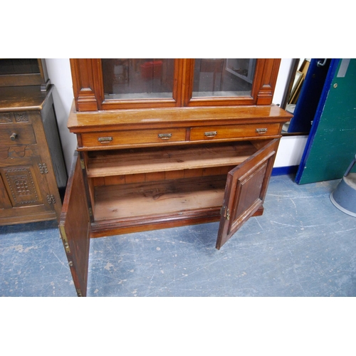 347 - Late Victorian mahogany library bookcase, the shaped cornice above two large glazed doors enclosing ... 