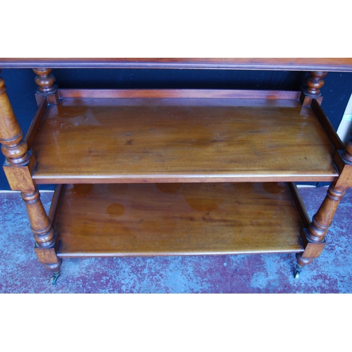 349 - Victorian mahogany buffet table with scroll pediment above three open tiers, on turned column suppor... 