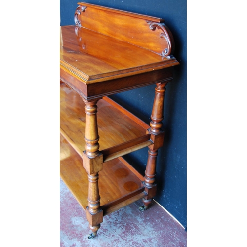 349 - Victorian mahogany buffet table with scroll pediment above three open tiers, on turned column suppor... 