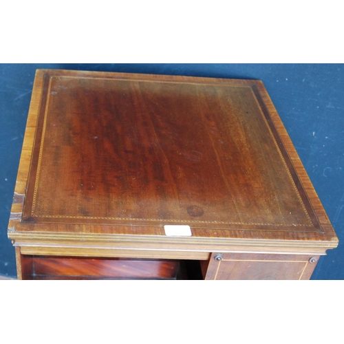 355 - Edwardian inlaid mahogany revolving bookcase with open divisions, on platform base with castors, 86c... 