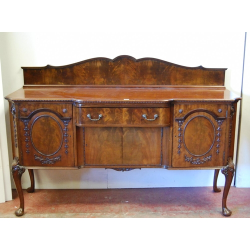 358 - Irish-style mahogany sideboard with shaped pediment above a large drawer and cupboard door flanked b... 