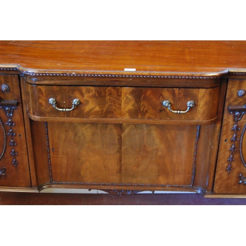 358 - Irish-style mahogany sideboard with shaped pediment above a large drawer and cupboard door flanked b... 