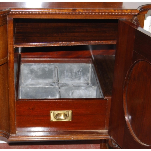 358 - Irish-style mahogany sideboard with shaped pediment above a large drawer and cupboard door flanked b... 