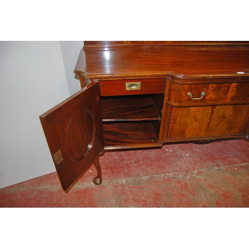 358 - Irish-style mahogany sideboard with shaped pediment above a large drawer and cupboard door flanked b... 