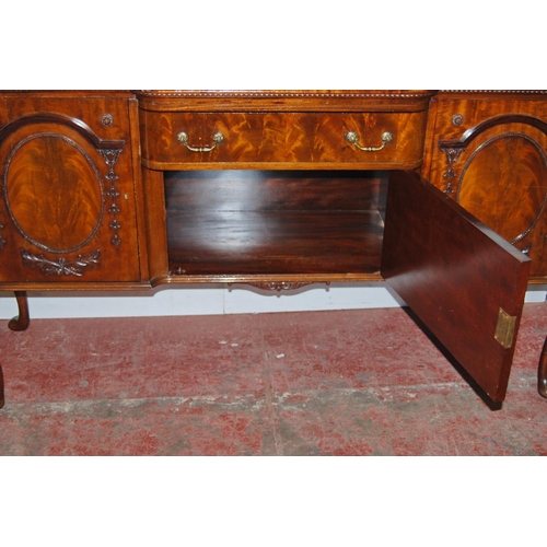 358 - Irish-style mahogany sideboard with shaped pediment above a large drawer and cupboard door flanked b... 