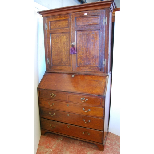 362 - 18th century and later oak and mahogany bureau cabinet, the top section with two panelled doors encl... 