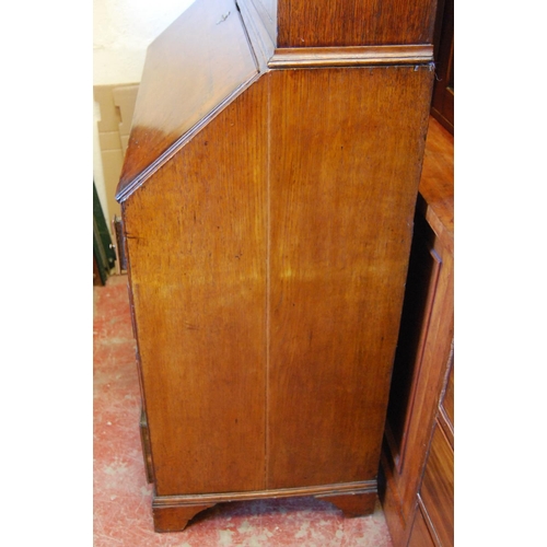 362 - 18th century and later oak and mahogany bureau cabinet, the top section with two panelled doors encl... 