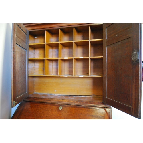 362 - 18th century and later oak and mahogany bureau cabinet, the top section with two panelled doors encl... 