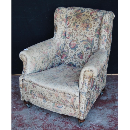 370 - Antique upholstered armchair in the style of Howard & Sons of London, upholstered in floral fabr... 