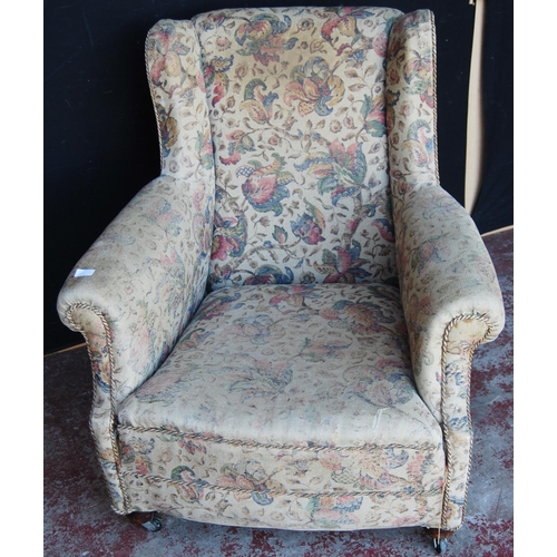 370 - Antique upholstered armchair in the style of Howard & Sons of London, upholstered in floral fabr... 