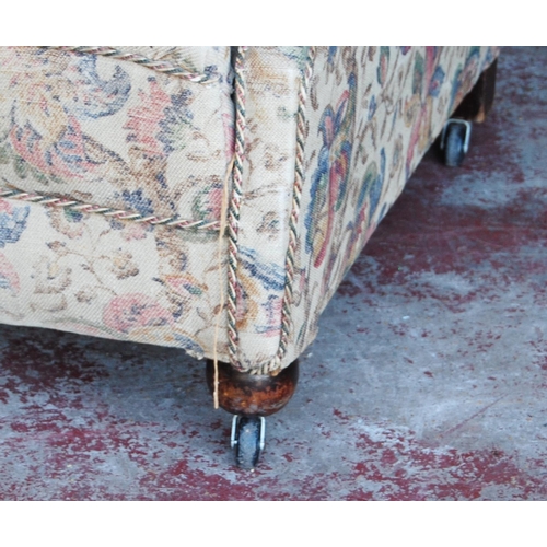 370 - Antique upholstered armchair in the style of Howard & Sons of London, upholstered in floral fabr... 