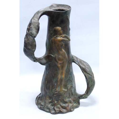 165 - Art Nouveau twin-handled pewter jug decorated with nude figures amongst the reeds, 32cm high.