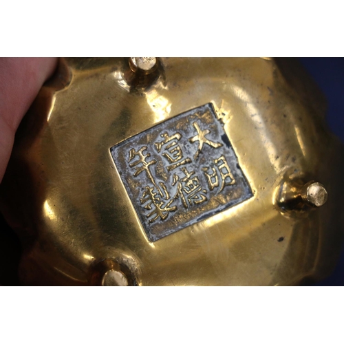 505 - Two Chinese brass censors, one with Kylin head handles and six character mark to base, 14cm diameter... 