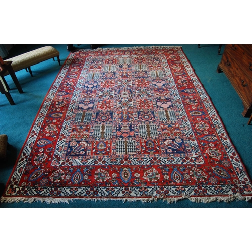 305 - Bakhtiari hand-knotted rug decorated with nine rows of five geometric and floral squares, with a flo... 