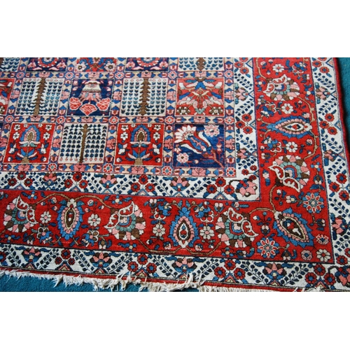 305 - Bakhtiari hand-knotted rug decorated with nine rows of five geometric and floral squares, with a flo... 