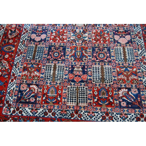 305 - Bakhtiari hand-knotted rug decorated with nine rows of five geometric and floral squares, with a flo... 