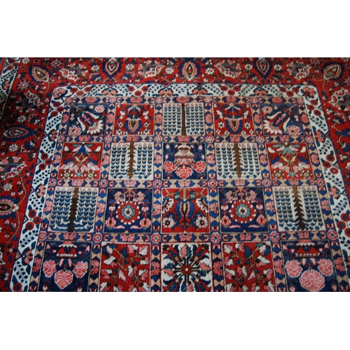 305 - Bakhtiari hand-knotted rug decorated with nine rows of five geometric and floral squares, with a flo... 