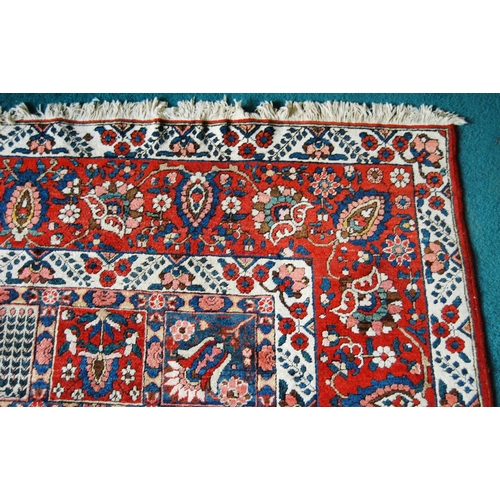 305 - Bakhtiari hand-knotted rug decorated with nine rows of five geometric and floral squares, with a flo... 