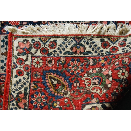 305 - Bakhtiari hand-knotted rug decorated with nine rows of five geometric and floral squares, with a flo... 