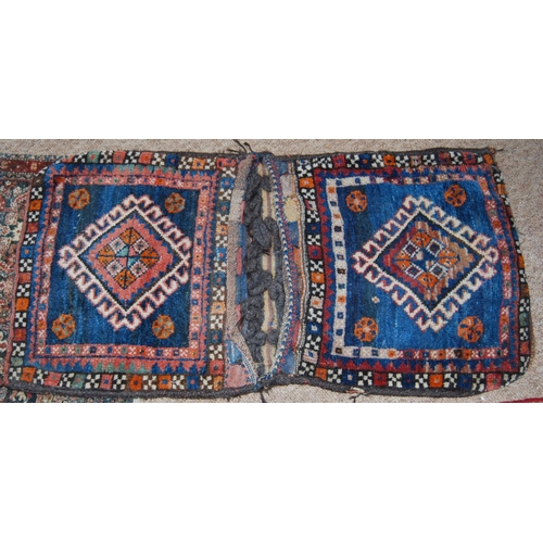 309 - Eastern saddle bag, 107cm x 54cm, a Qashqai-style two-section prayer mat and a cushion.  (3)