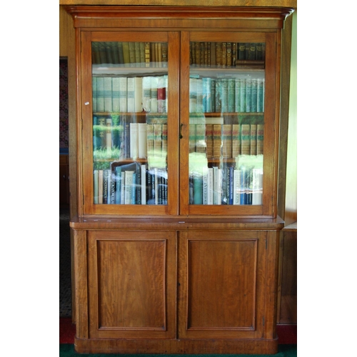 330 - Victorian mahogany two-door library bookcase, the upper section enclosed by glazed doors above two c... 