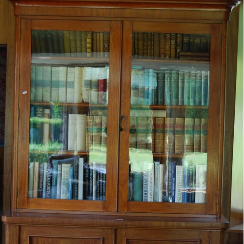 330 - Victorian mahogany two-door library bookcase, the upper section enclosed by glazed doors above two c... 