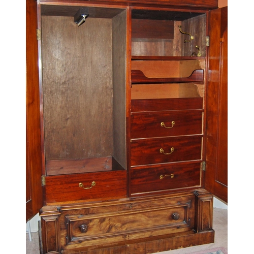 343 - Victorian mahogany wardrobe enclosed by a pair of panel doors over a single drawer, flanked by carve... 