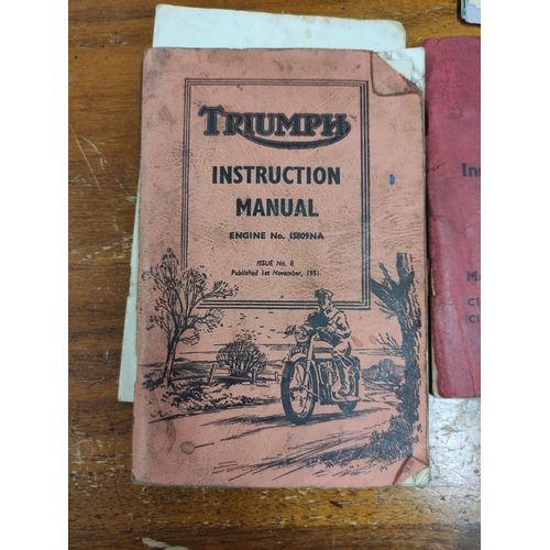 Collection of vintage motorcycle brochures and instruction manuals