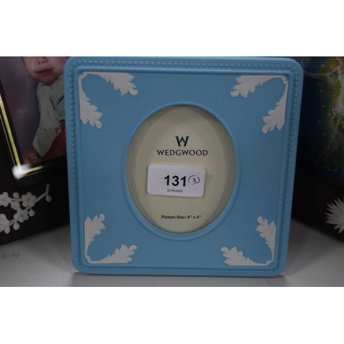 131 - Pair of Wedgwood brown and white glazed photograph frames and a Wedgwood blue Jasper ware photograph... 