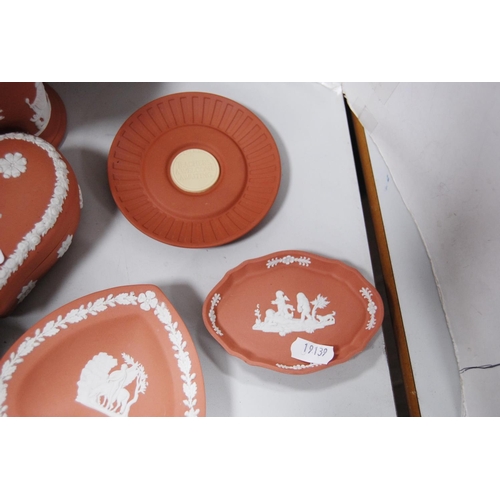 138 - Group of coral-coloured Wedgwood Jasper ware to include spill vase, heart-shaped box and cover and f... 