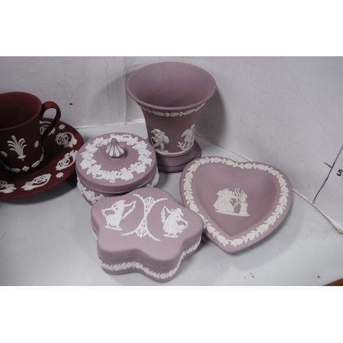 140 - Pink, claret and lilac-coloured Wedgwood Jasper ware to include spill vases, heart-shaped pin dishes... 