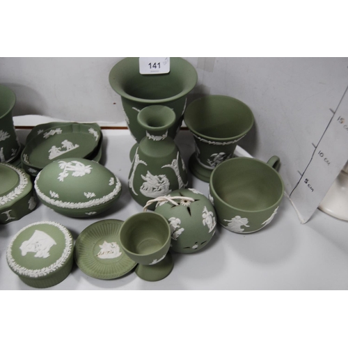 141 - Group of green Wedgwood Jasper ware to include boxes and covers, spill vases, cup, pin dishes etc.  ... 